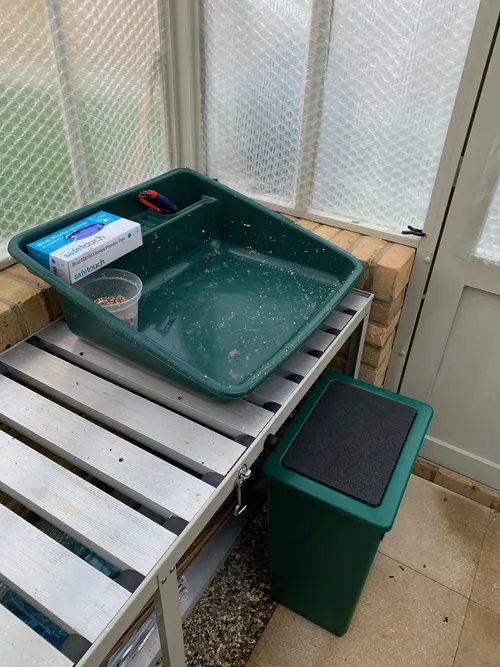 01. My potting bench. The seat is actually a storage container, providing a convenient place for sphagnum moss, orchid bark, and so on