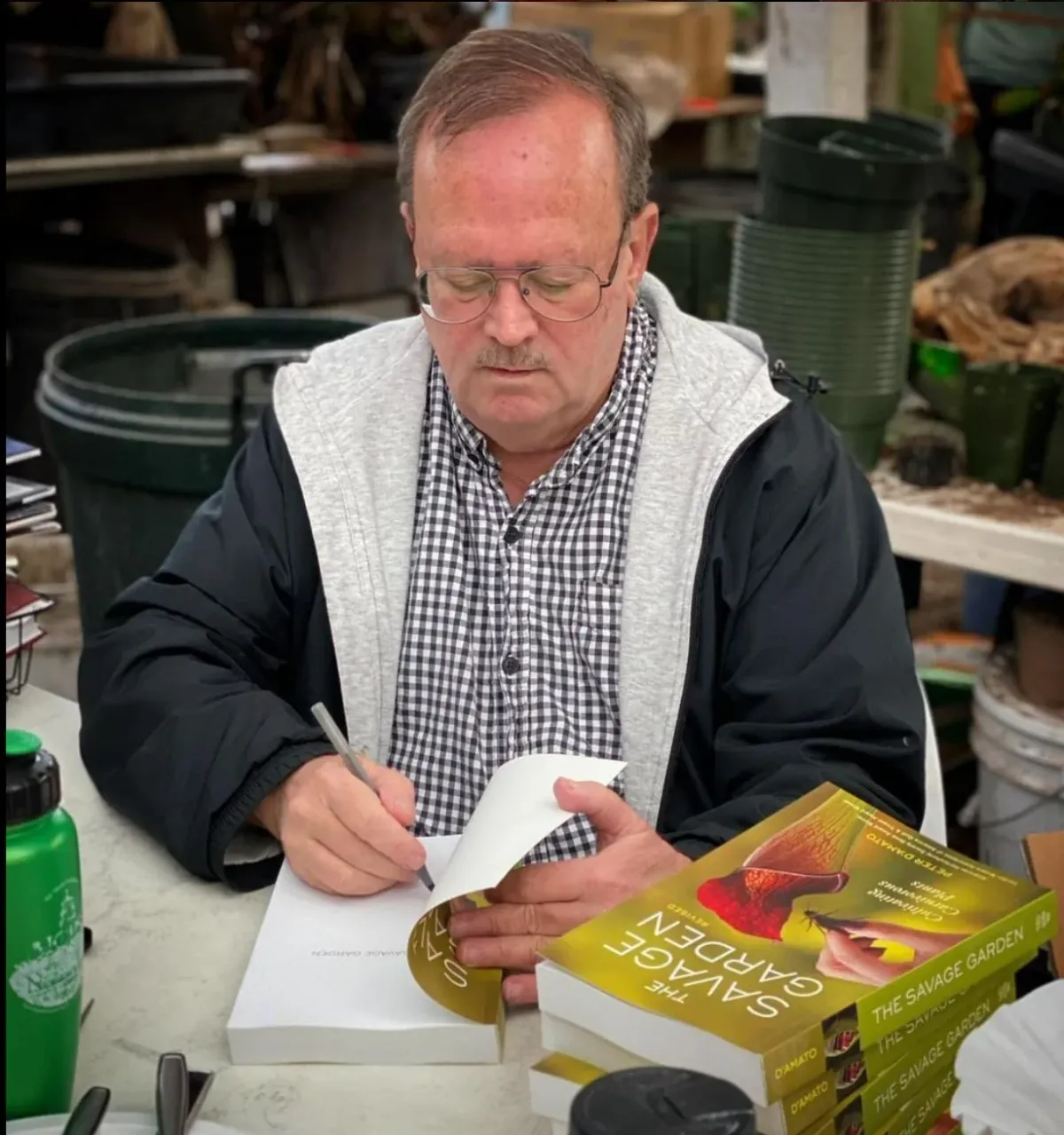 Peter D'Amato signing copies of The Savage Garden, his essential book on carnivorous plants.