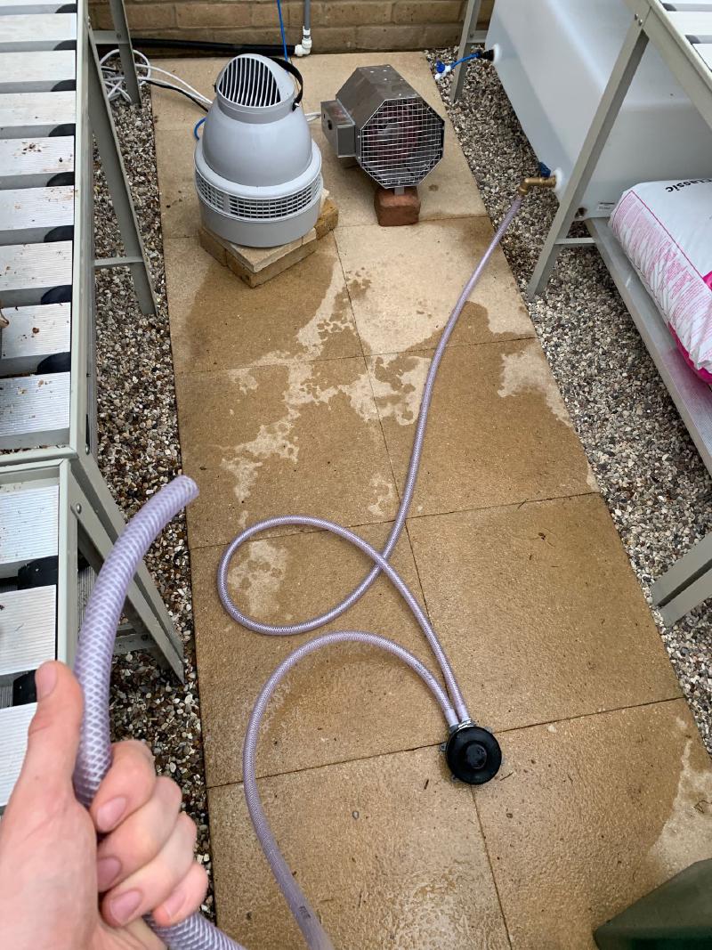 My 100 litre (22 gallon) flat-bed tank for purified water has two BSP screw fittings, one of which I'm using with a foot pump so I can water using a hose.